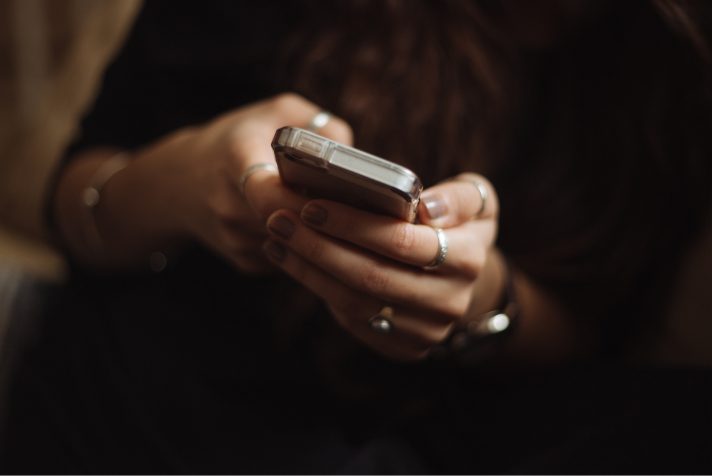 Woman using an iPhone