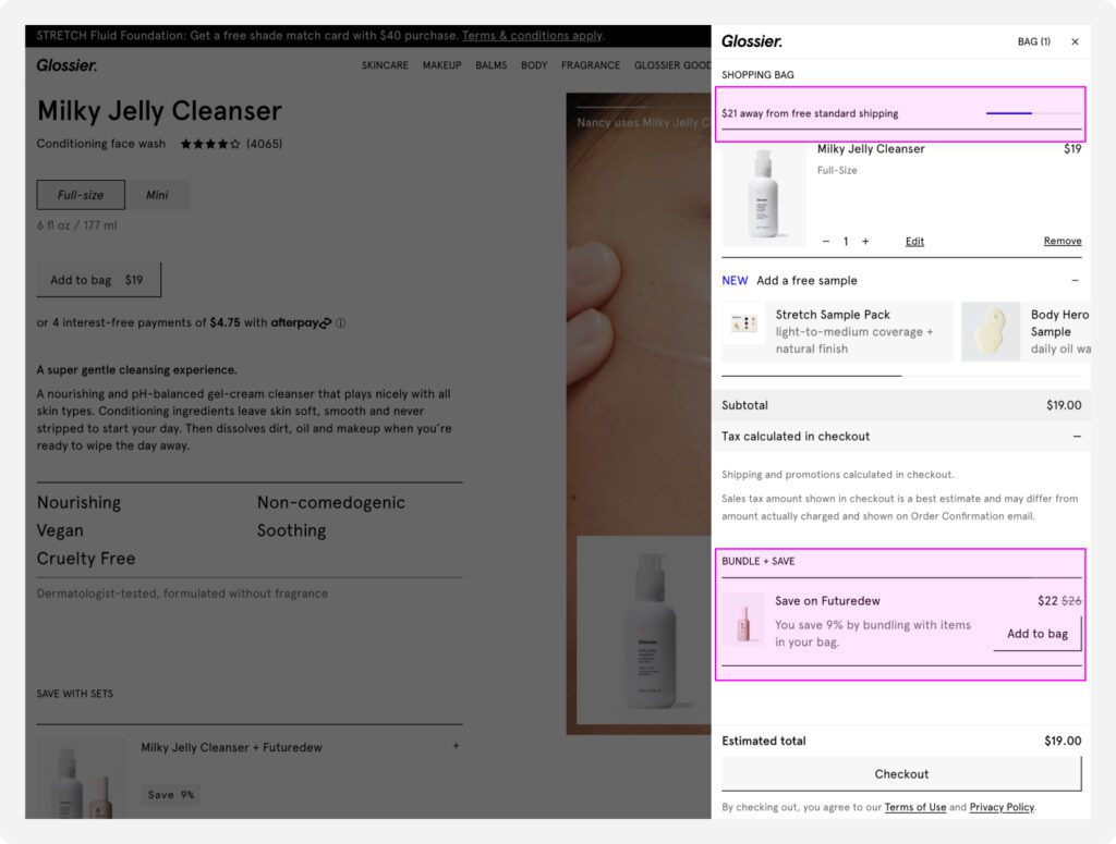 Glossier's cart offers a "Bundle & Save" upsell to the customer that will unlock free shipping. 